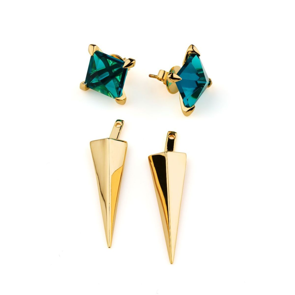 Pair of gold spike earrings with green gemstones on a white background