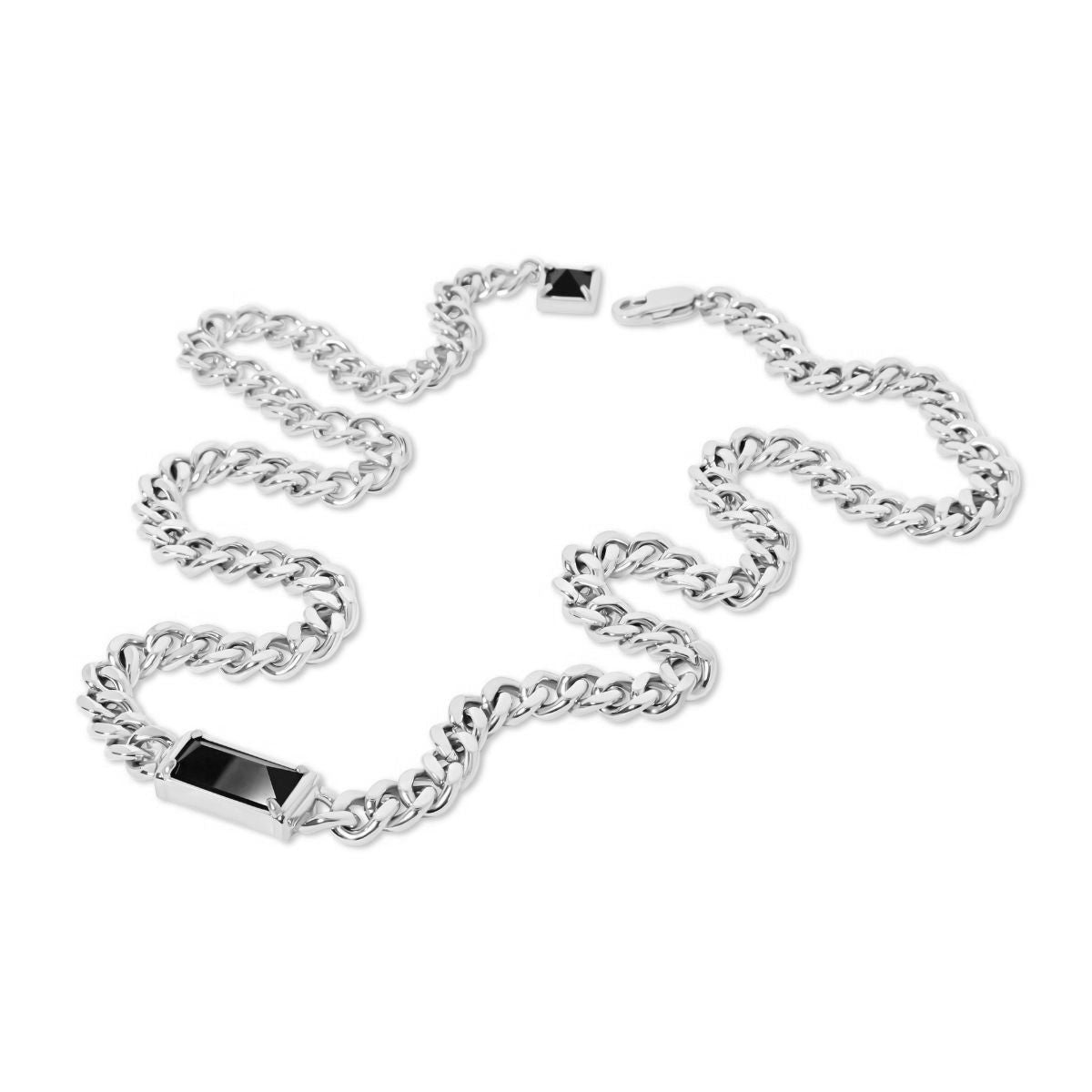 A silver-toned chain bracelet with a rectangular black inlay on one side and a small black square accent near the clasp, displayed on a clean white background.