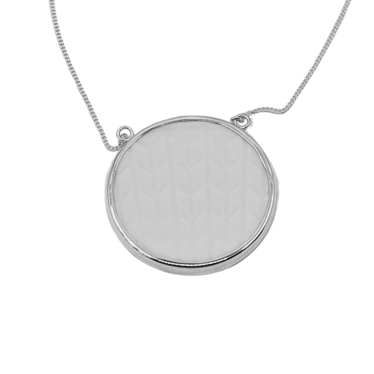 Silver necklace with a round pendant on a white background